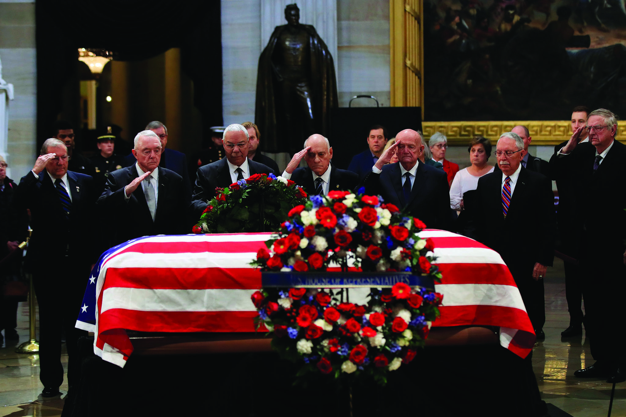 Former Secretary of State Colin Powell, third from left, leads former Operation Desert Storm commanders as they pay their last respects to former President George H.W. Bush as he lies in state at the U.S. Capitol in Washington, Tuesday, Dec. 4, 2018. (AP Photo/Manuel Balce Ceneta)