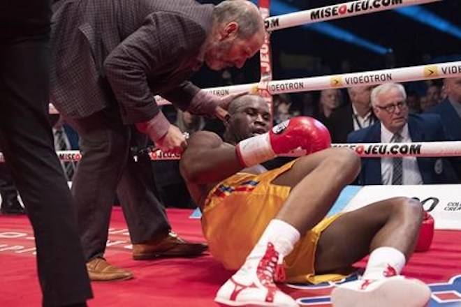 Ring doctor Marc Gagne, left, checks on Adonis Stevenson, of Montreal, after he was knocked out by Oleksandr Gvozdyk of Ukraine in their Light Heavyweight WBC championship fight, Saturday, December 1, 2018 in Quebec City. THE CANADIAN PRESS/Jacques Boissinot
