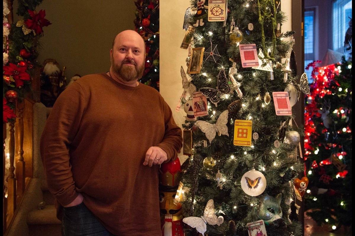 Red Deer resident Vince Jackman stands beside one of the 105 decorated Christmas trees in his home at 42 Comfort Close Thursday. To raise money for the Central Alberta Humane Society, Jackman and his partner are inviting Red Deerians over Dec. 9th to see the trees and leave a donation. Robin Grant/Red Deer Express