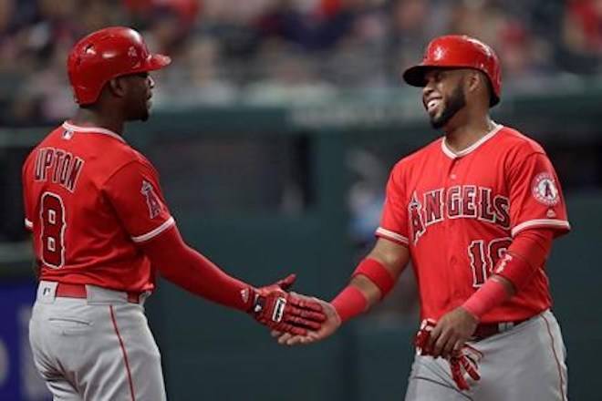 Los Angeles Angels’ Luis Valbuena is congratulated by Justin Upton after Valbuena scored during the eighth inning against the Cleveland Indians in a baseball game in Cleveland on August 3, 2018.THE CANADIAN PRESS/AP, Tony Dejak