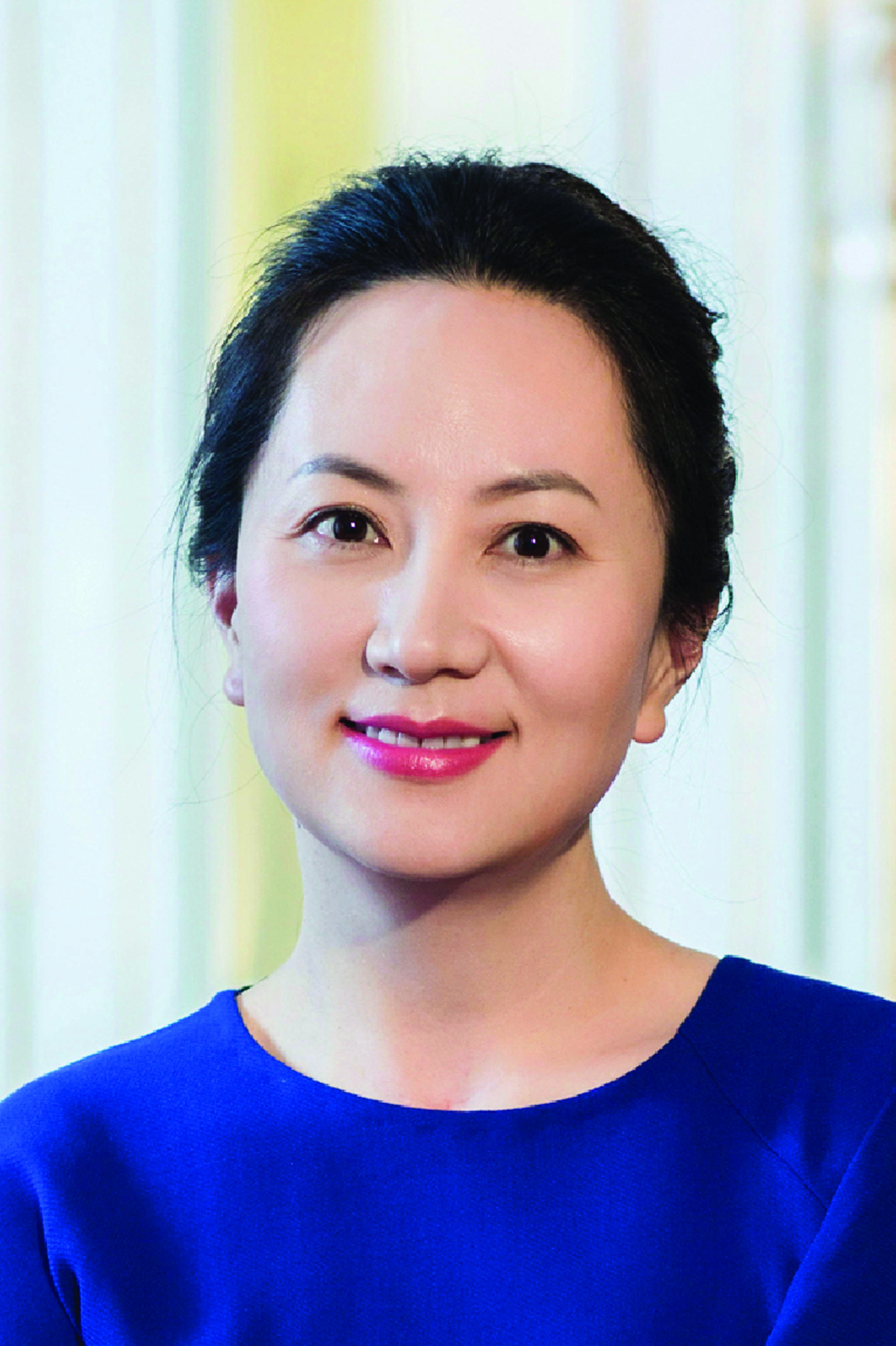 In this undated photo released by Huawei, Huawei’s chief financial officer Meng Wanzhou is seen in a portrait photo. China on Thursday, Dec. 6, 2018, demanded Canada release the Huawei Technologies executive who was arrested in a case that adds to technology tensions with Washington and threatens to complicate trade talks. (Huawei via AP)