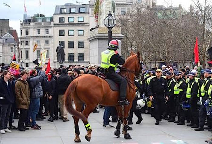 Police attempt to keep rival Brexit protest groups from clashing in central London, Sunday Dec. 9, 2018. (Victoria Jones/PA via AP)