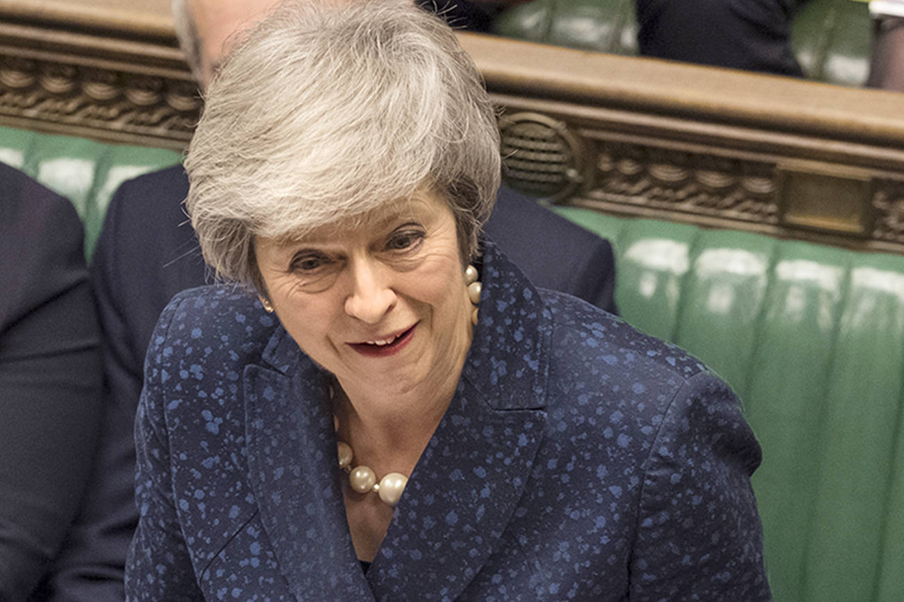 Britain’s Prime Minister Theresa May speaks during the regular scheduled Prime Minister’s Questions inside the House of Commons in London, Wednesday Dec. 12, 2018. May has confirmed there will be a vote of confidence in her leadership of the Conservative Party, later Wednesday, with the result expected to be announced soon after. (Mark Duffy/UK Parliament via AP)