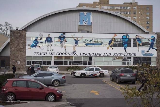 Toronto police respond to a bomb threat at St. Michael’s College School, in Toronto on Monday, Nov. 19, 2018. THE CANADIAN PRESS/ Tijana Martin