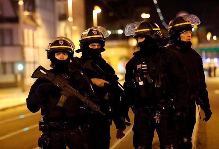 French police officers stand guard in Strasbourg, eastern France, Thursday, Dec. 13, 2018. (AP Photo/Christophe Ena)