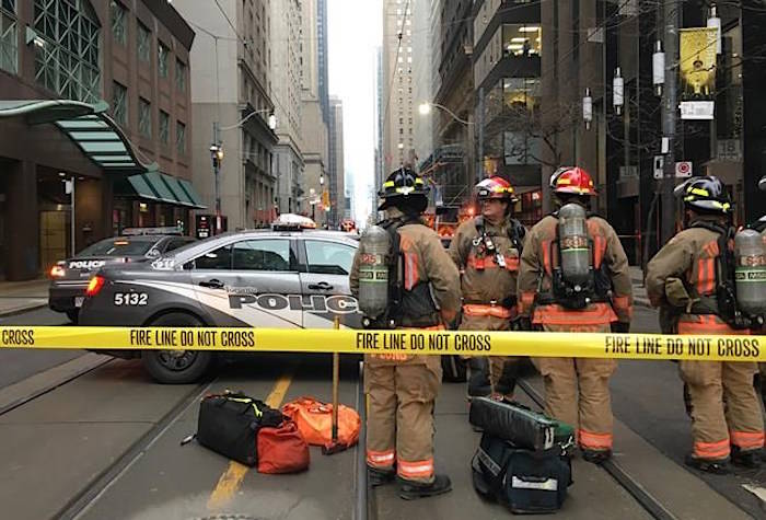 Firefighters stand by their equipment after a bomb threat evacuated the King Street subway station in downtown Toronto, Thursday, Dec. 13, 2018. THE CANADIAN PRESS/Graeme Roy