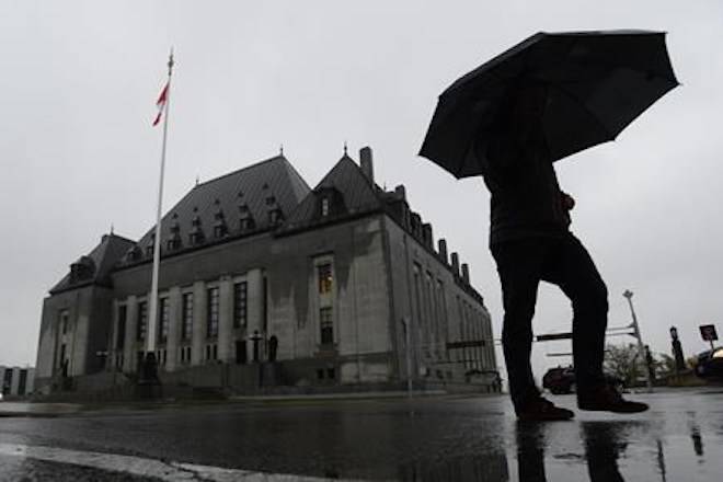 A man walks pass the Supreme Court of Canada in Ottawa on Thursday, Nov. 2, 2017. File photo. THE CANADIAN PRESS/Sean Kilpatrick                                A man walks pass the Supreme Court of Canada in Ottawa on Thursday, Nov. 2, 2017. File photo. THE CANADIAN PRESS/Sean Kilpatrick