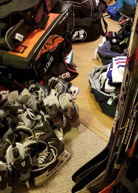Donated hockey equipment is shown in Vancouver high school hockey coach Todd Hickling’s basement in a handout photo. THE CANADIAN PRESS/Todd Hickling