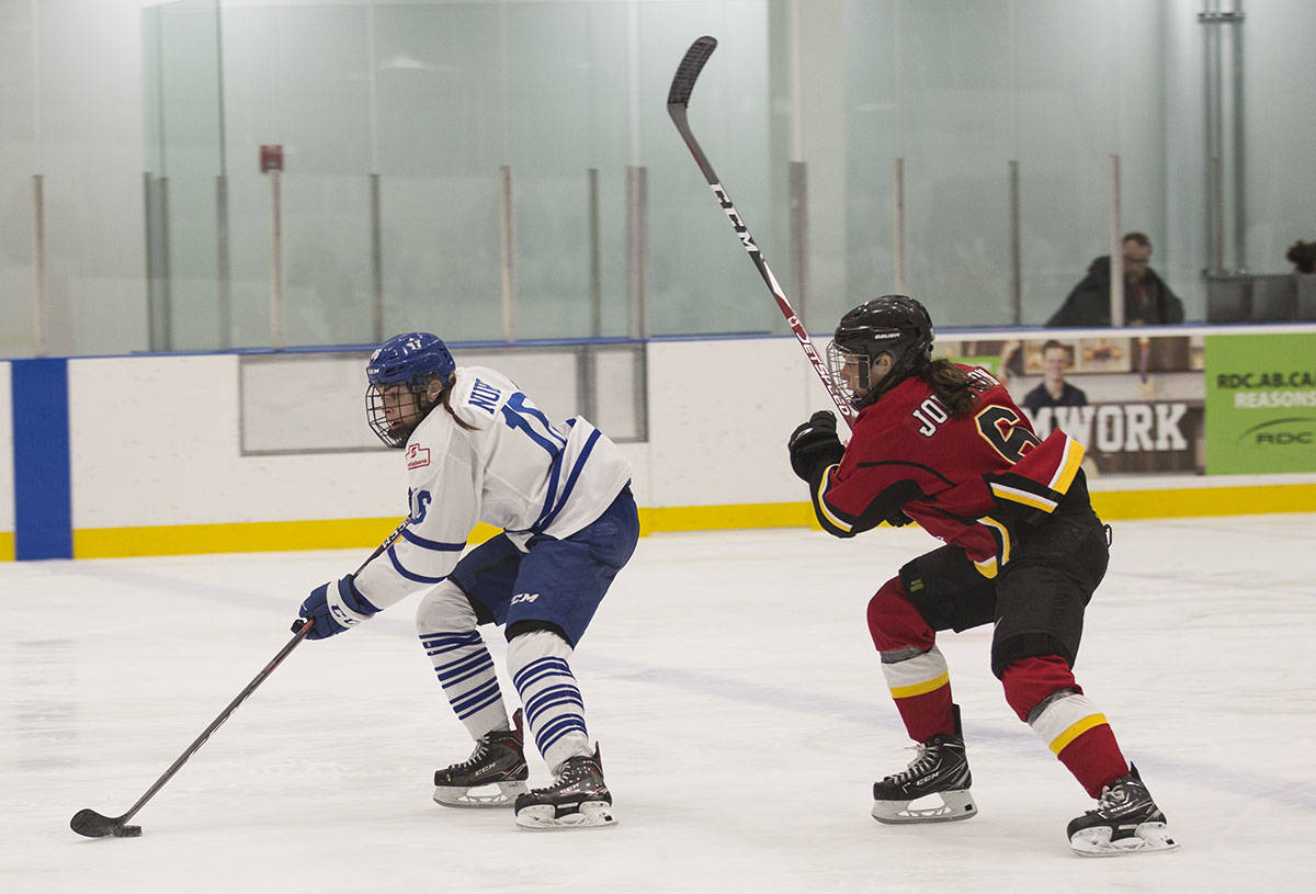 Calgary Inferno Captain Rebecca Johnston chases after Toronto Furies Forward Sarah Nurse for the puck Saturday night. The Furies beat Calgary, 4-1, at the game on the first Female Hockey Day in Alberta. Robin Grant/Red Deer Express