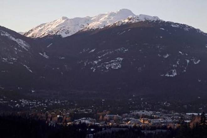 The village of Whistler, B.C. is seen as the sun sets on the snow capped mountains Friday, Feb. 3, 2012. THE CANADIAN PRESS/Jonathan Hayward