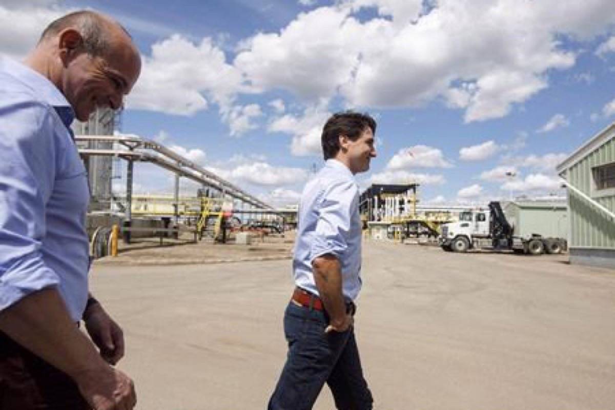 Prime Minister Justin Trudeau, right and Edmonton member of parliament, Randy Boissonnault visit the Kinder Morgan terminal in Edmonton on Tuesday June 5, 2018. Trudeau says he is overhauling how Canada assesses big energy projects in order to get Canada to the point where new projects can get built without the government having to buy them to make that happen. (Jason Franson/The Canadian Press)