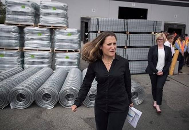 Minister of Foreign Affairs Chrystia Freeland, front, leaves a news conference after touring Tree Island Steel, in Richmond, B.C., on Friday, Aug. 24, 2018. THE CANADIAN PRESS/Darryl Dyck