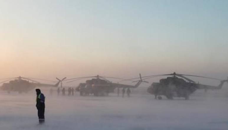 Search and rescue helicopters are seen before a flight to the landing area of the Soyuz MS-09 capsule with the International Space Station (ISS) crew onboard during sunrise in the town of Zhezkazgan, formerly known as Dzhezkazgan, Kazakhstan, Thursday, Dec. 20, 2018. (Shamil Zhumatov/Pool Photo via AP)