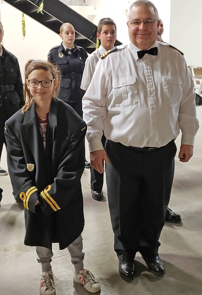 126 Royal Canadian Sea Cadet Corps’ youngest and newest member Katelin Trohan (left) received a temporary promotion for the night taking over for Commanding Officer Lt(N) Jim Bricker (right). 126 Red Deer held their Christmas Mess Dinner exposing the Cadets to Naval Traditions. During these festive times, rules are bent in a playful way. Commanding Officers frequently switch roles and tunics with the youngest member of the unit. This Cadet then becomes the honorary commander for the day. photo submitted