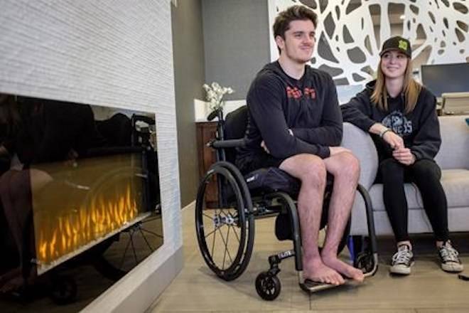Humboldt Broncos bus crash survivor Ryan Straschnitzki, left, is interviewed with his girlfriend Erika Burns in Airdrie, Alta., Thursday, Sept. 27, 2018.THE CANADIAN PRESS/Jeff McIntosh