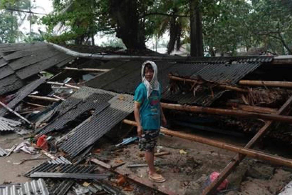 A man inspects his house which was damaged by a tsunami, in Carita, Indonesia, Sunday, Dec. 23, 2018. The tsunami apparently caused by the eruption of an island volcano killed a number of people around Indonesia’s Sunda Strait, sending a wall of water crashing some 65 feet (20 meters) inland and sweeping away hundreds of houses including hotels, the government and witnesses said. (AP Photo/Dian Triyuli Handoko)