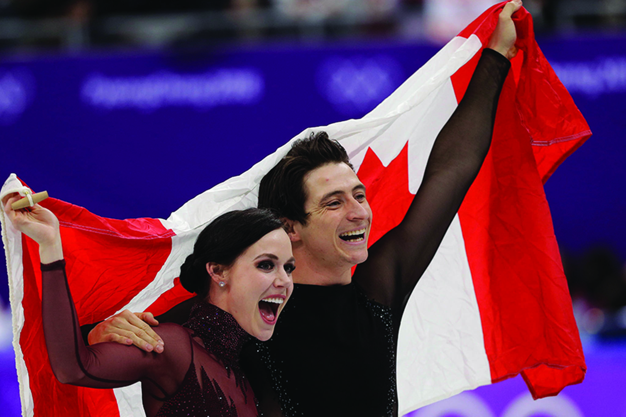Tessa Virtue and Scott Moir of Canada celebrate during the venue ceremony after winning the ice dance, free dance figure skating final in the Gangneung Ice Arena at the 2018 Winter Olympics in Gangneung, South Korea, Tuesday, Feb. 20, 2018. (AP Photo/David J. Phillip)