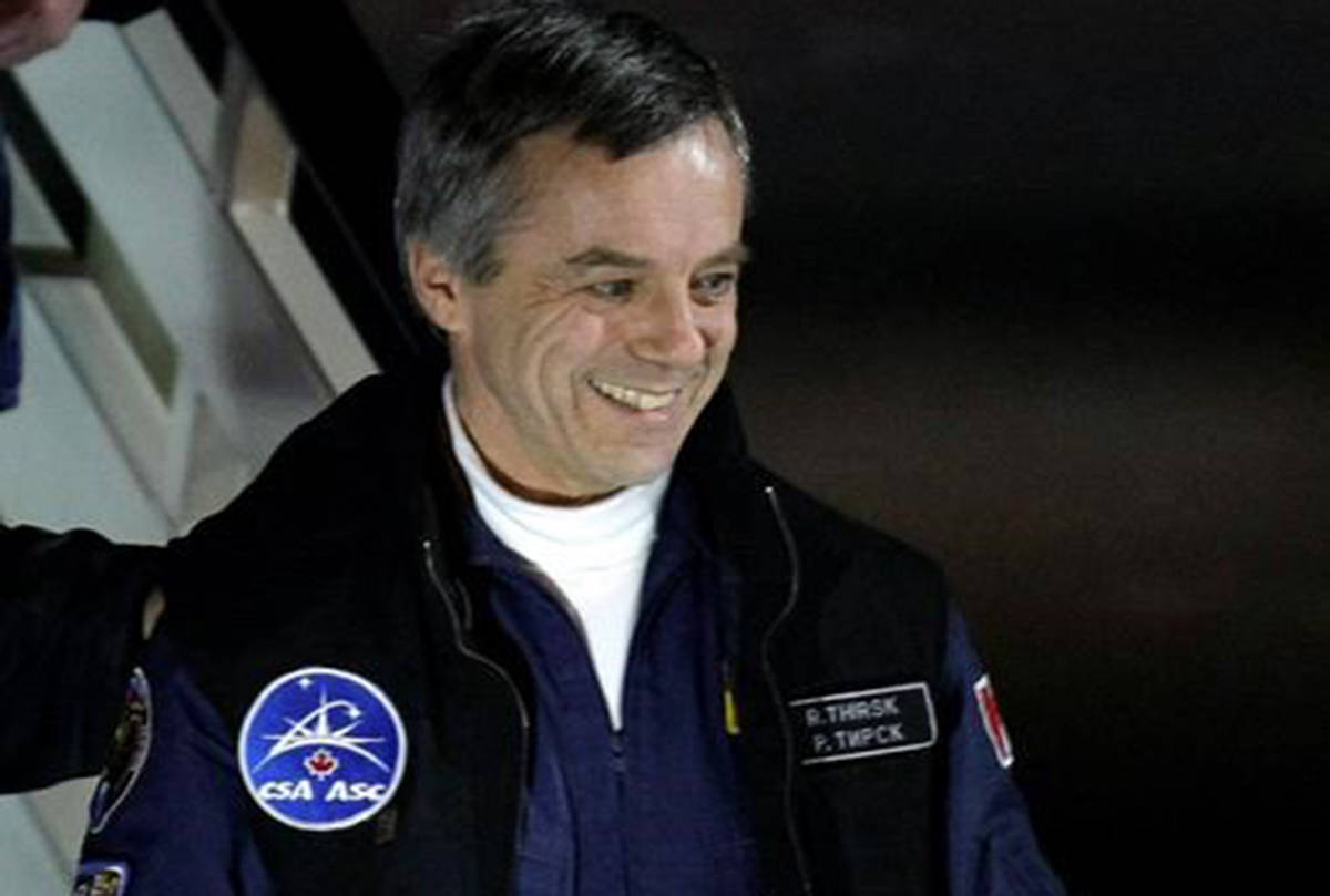 Canadian astronaut Robert Thirsk smiles as he arrival at the Star City, outside Moscow, Russia, Wednesday, Dec. 2, 2009. The Canadian Space Agency wants to hire former astronaut Thirsk to help it figure out how to contribute medical expertise to a human mission to Mars. (Misha Japaridze/The Canadian Press)