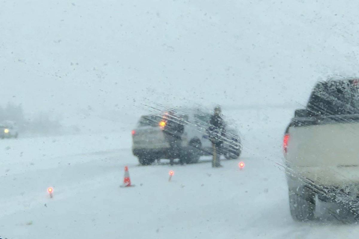 Stony Plain RCMP re-route traffic away from the jackknifed semi and 30 car pile up Dec. 29. Photo by Amy Jean Edwards-Bird