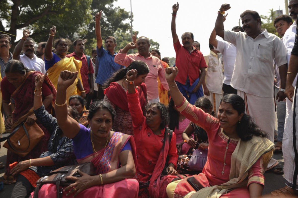 Protesters block traffic and shout slogans reacting to reports of two women of menstruating age entering the Sabarimala temple, one of the world’s largest Hindu pilgrimage sites, in Thiruvananthapuram, Kerala, India, Wednesday, Jan. 2, 2019. India’s Supreme Court on Sept. 28, 2018 lifted the ban on women of menstruating age from entering the temple, holding that equality is supreme irrespective of age and gender. (AP Photo/R S Iyer)