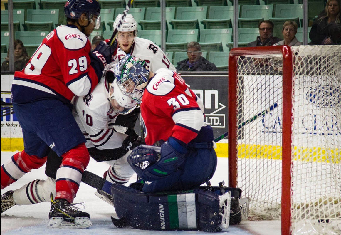 With just 6.6 seconds left on the clock, Forward Cameron Hausinger gets the puck past Hurricanes Netminder Liam Hughes and ties the game. Red Deer made an incredible comeback Wednesday to beat the Hurricanes in a shootout. Robin Grant/Red Deer Express