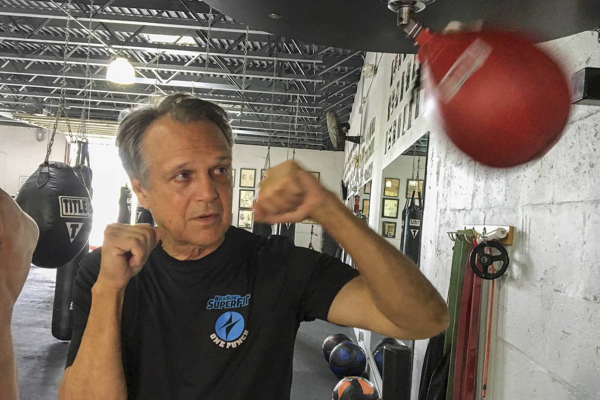 Steve Shepherd, a world champion kickboxer, works out Thursday, Jan. 3, 2019, in West Palm Beach, Fla. Shepherd was limping to his car last week, a pulled muscle impairing his stride, when a mugger hit him in the head with a bottle and demanded his cellphone. Shepherd threw a right cross to the attacker’s head, and then smashed a hook to his ribs, crumpling him. Bystanders interceded and the man escaped. Shepherd suffered a ruptured eardrum, a cut and bruise. (Catie Wegman/Palm Beach Post via AP)