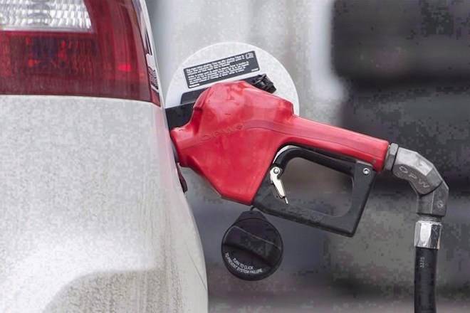 A gas pump is shown at a station in Montreal on April 12, 2017. Extreme volatility in oil markets has resulted in a price jump for gasoline of four cents a litre in Metro Vancouver and an analyst predicts a further hike could arrive within days. THE CANADIAN PRESS/Graham Hughes