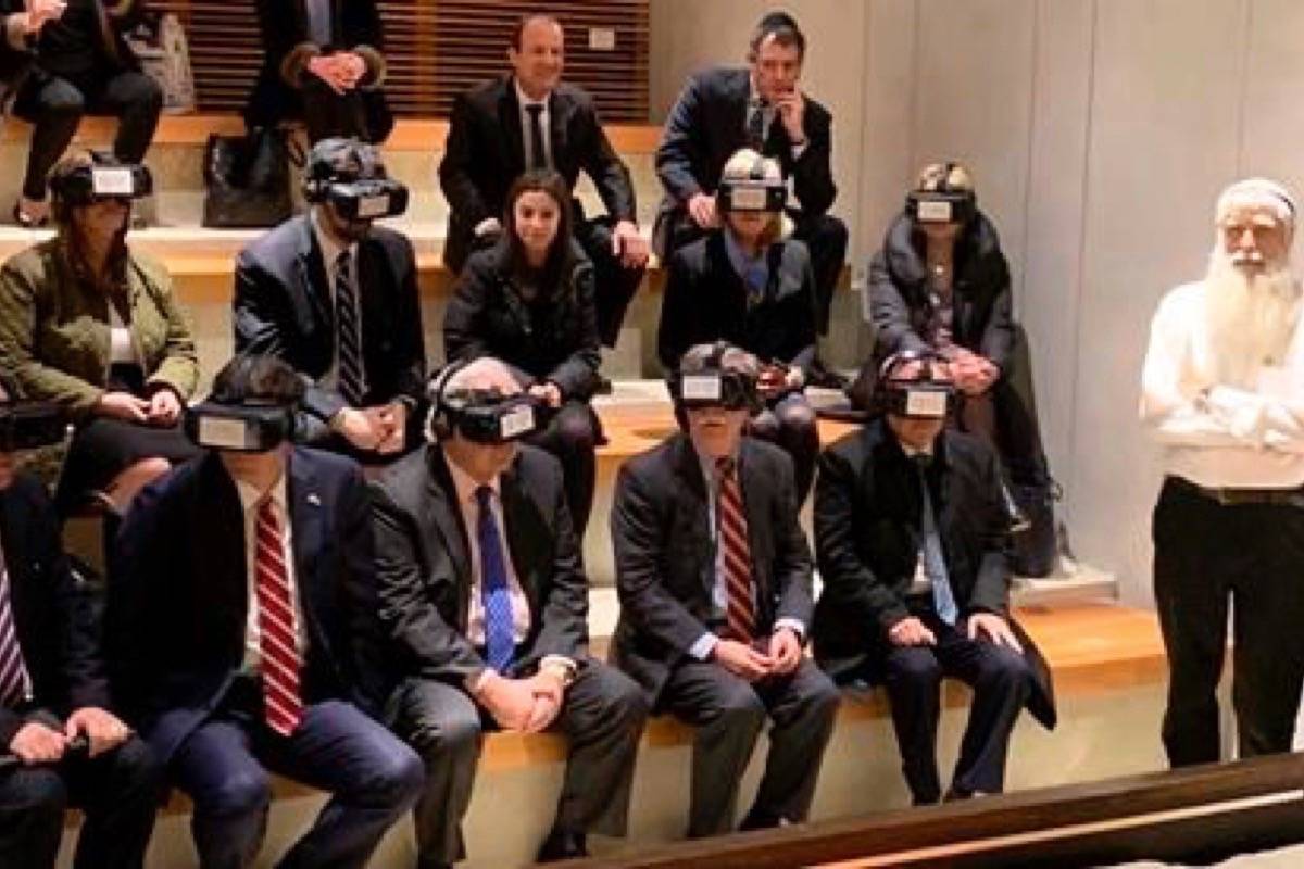 U.S. National Security Adviser John Bolton, seated front row forth from left, participates in a virtual reality demonstration at the Western Wall on Sunday, Jan. 6, 2019, in Jerusalem. U.S. Ambassador to Israel David Friedman and Israeli Ambassador to the U.S. Ron Dermer are sitting alongside. (AP Photo/Zeke Miller)