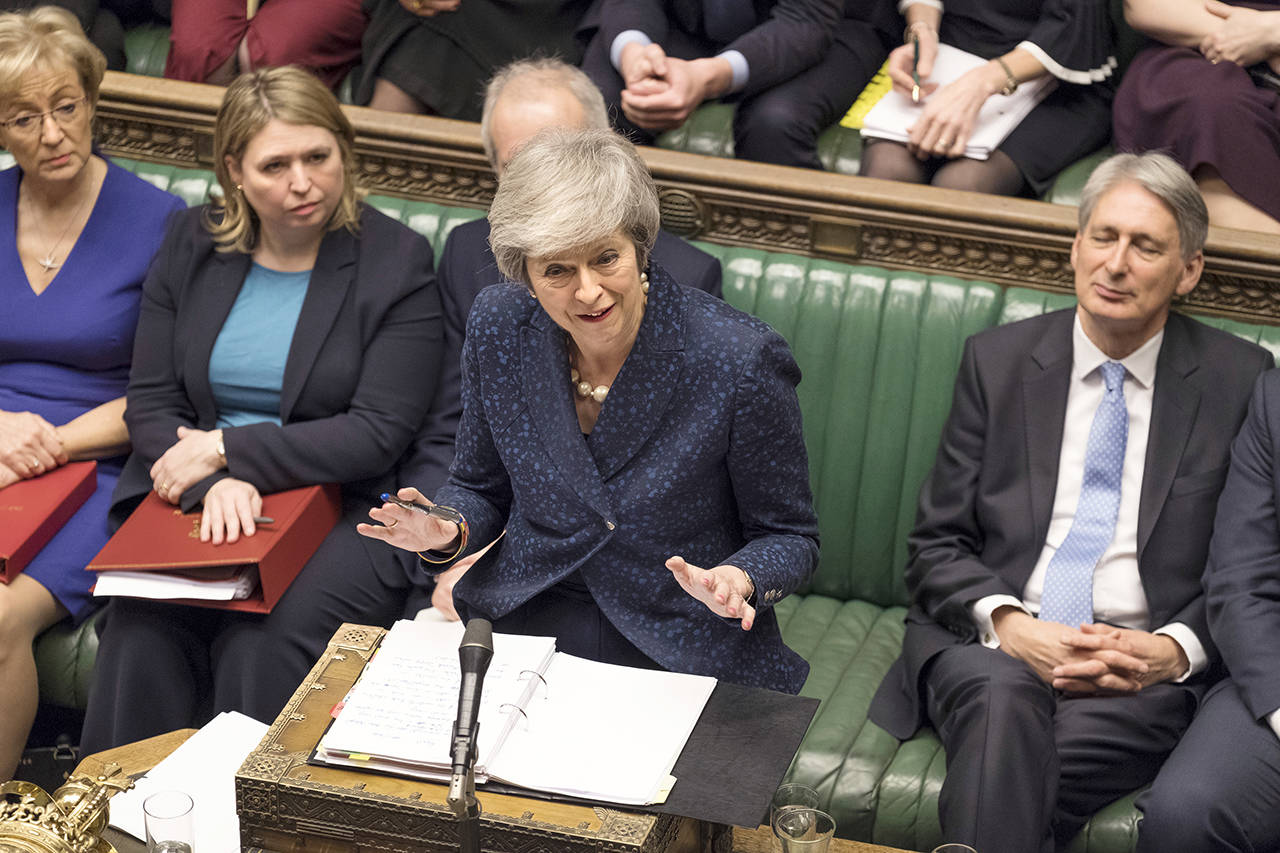 Britain’s Prime Minister Theresa May speaks during the regular scheduled Prime Minister’s Questions inside the House of Commons in London, Wednesday Dec. 12, 2018. (Mark Duffy/UK Parliament via AP)