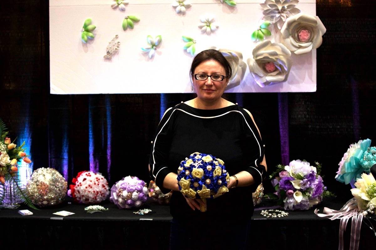 Anila Begaj holds up a brooch bouquet that is sold at the local wedding vendor Elegant Brooch Bride. The annual Sheraton Bridal Showcase took place Sunday afternoon from 1 to 4 p.m. Robin Grant/Red Deer Express