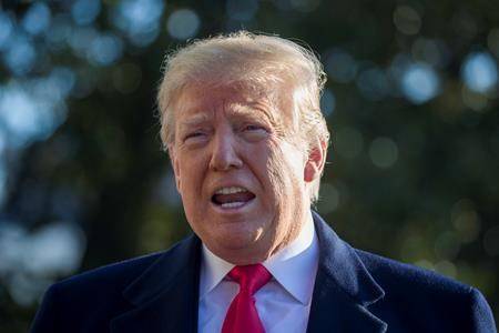 U.S. President Donald Trump speaks on the South Lawn of the White House while walking to Marine One, Sunday, Jan. 6, 2019, in Washington. (AP Photo/Alex Brandon)