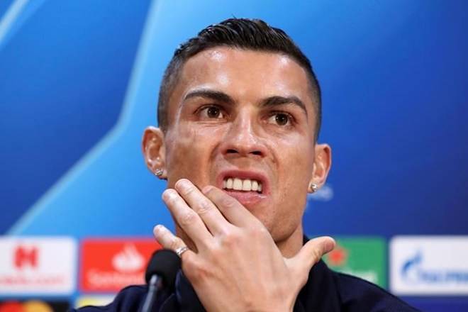 FILE - In this Oct. 22, 2018, file photo, Juventus’ Cristiano Ronaldo attends a press conference at Old Trafford, Manchester. Ronaldo is being asked by police in the U.S. to provide a DNA sample in an ongoing investigation of a Nevada woman’s allegation that he raped her in his Las Vegas hotel penthouse in 2009, the soccer star’s lawyer in Las Vegas said Thursday, Jan. 10, 2019. England. (Martin Rickett/PA via AP, File)