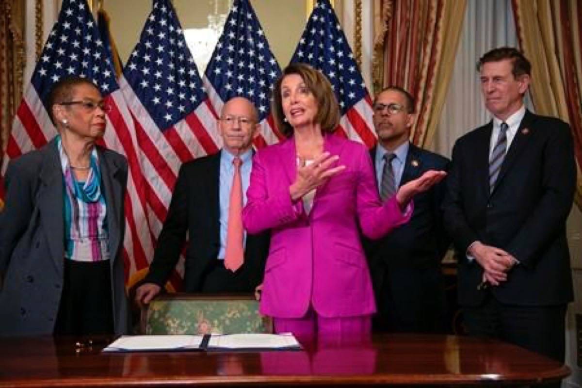 Speaker of the House Nancy Pelosi, D-Calif., talks to reporters after signing a House-passed a bill requiring that all government workers receive retroactive pay after the partial shutdown ends, at the Capitol in Washington, Friday, Jan. 11, 2019. She is joined by, from left, Delegate Eleanor Holmes Norton, D-D.C., Rep. Peter DeFazio, D-Ore., Rep. Anthony Brown, D-Md., and Rep. Don Beyer D-Va. (AP Photo/J. Scott Applewhite)