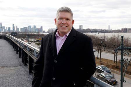 Tripp Harris, who was a passenger on US Airways Flight 1549, the “Miracle on the Hudson” airliner in 2009, stands on the High Line along the Hudson River in New York. (AP Photo/Richard Drew)