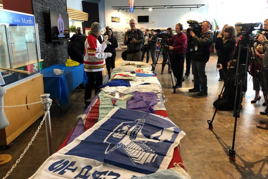 Lyn Radford, chair of the 2019 Canada Winter Games committee, lays out some of the items she took from the time capsule created when the last Canada Winter Games was held in Grande Prairie, Alta. in 1995. Robin Grant/Red Deer Express
