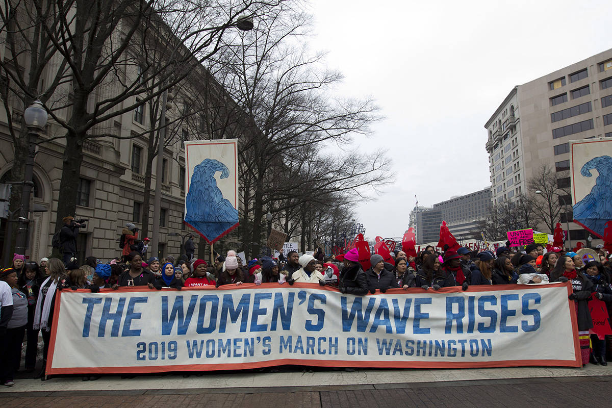 Demonstrators march on Pennsylvania Av. during the women’s march in Washington on Saturday, Jan. 19, 2019. (AP Photo/Jose Luis Magana)
