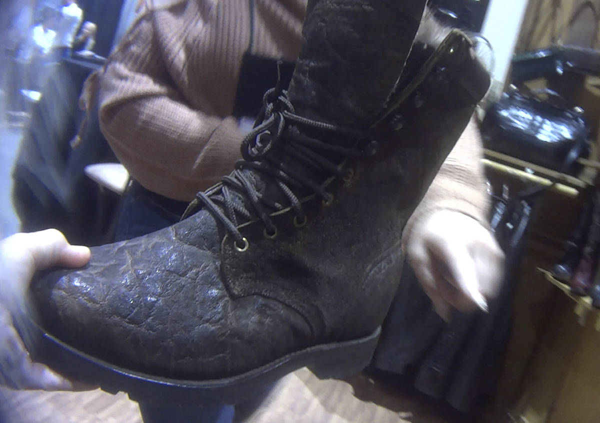 In this image provided by the Humane Society of the United States, a hunting boot, labeled that it was made from elephant hide, is displayed at the Safari Club International conference in Reno, Nev., on Jan. 9, 2019. Photos and video taken by animal welfare activists show an array of potentially illicit products crafted from the body parts of threatened big-game animals, including boots, chaps, belts and furniture labeled as elephant leather. (Humane Society of the United States via AP)