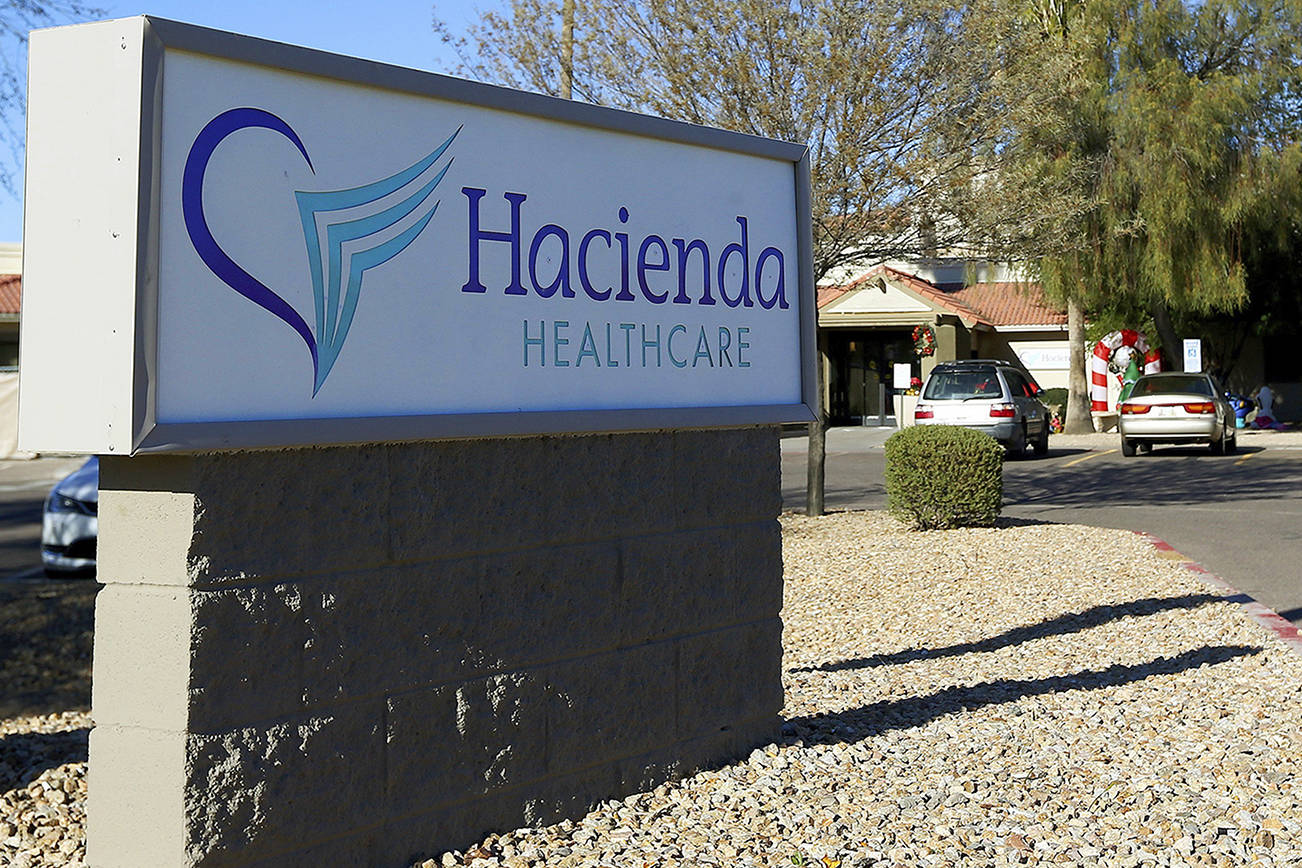 This Friday, Jan. 4, 2019, photo shows Hacienda HealthCare in Phoenix. The revelation that a Phoenix woman in a vegetative state recently gave birth has prompted Hacienda HealthCare CEO Bill Timmons to resign, putting a spotlight on the safety of long-term care settings for patients who are severely disabled or incapacitated. (AP Photo/Ross D. Franklin)