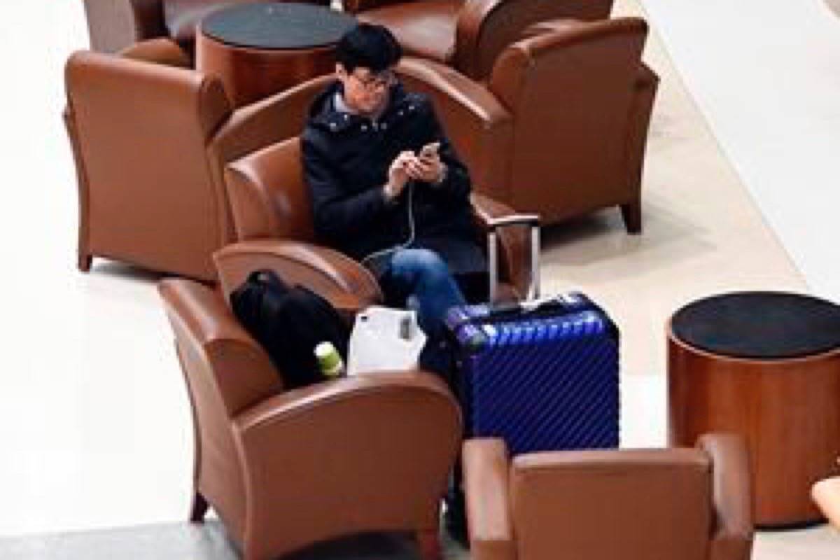 Airline passengers wait out a major snowstorm as flights were canceled or severely delayed at Albany International Airport in Colonie, N.Y., Sunday, Jan. 20, 2019. A major winter storm that blanketed much of the Midwest with snow earlier in the weekend is barreling toward New England, where it is expected to wreak transportation havoc from slick and clogged roads to hundreds of canceled airline flights. (AP Photo/Hans Pennink)