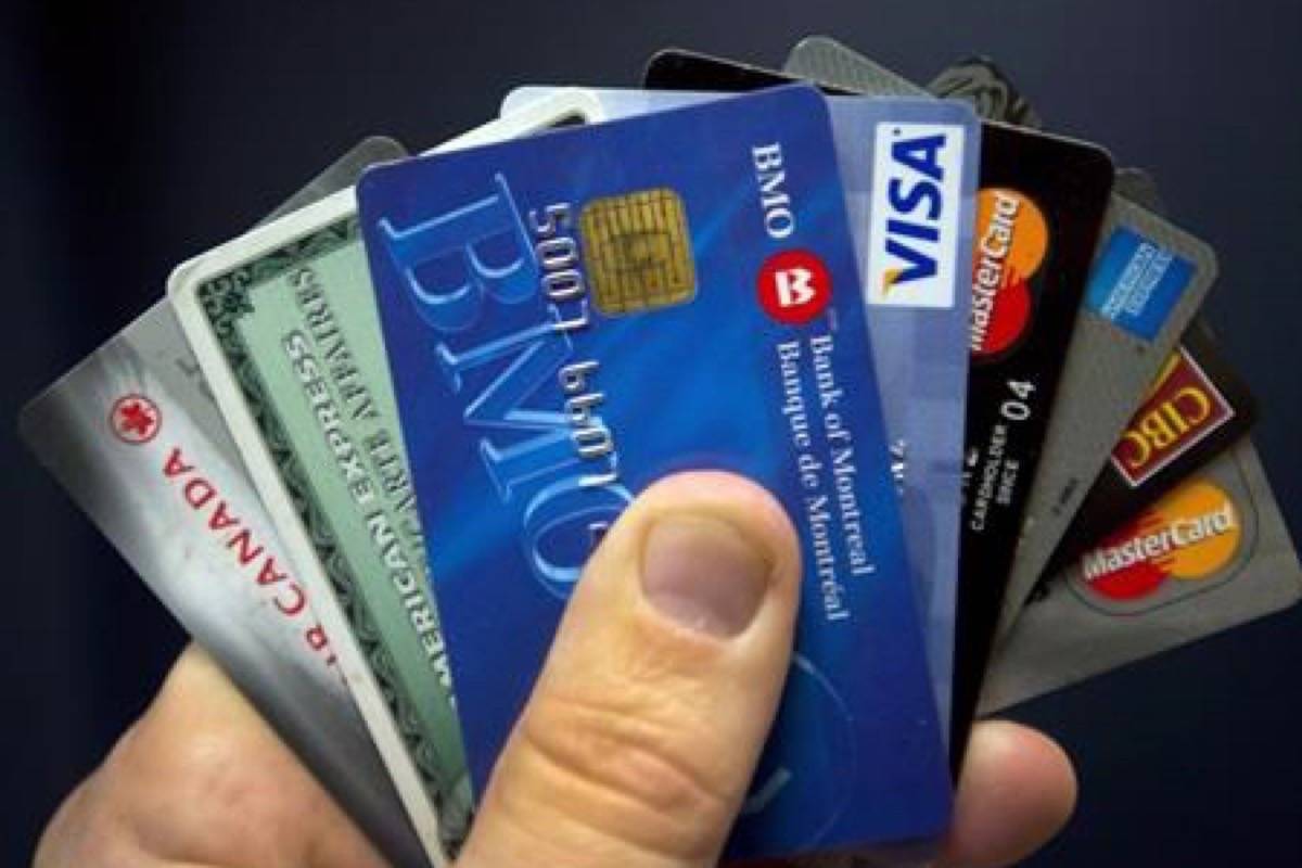 Credit cards are displayed in Montreal, Wednesday, December 12, 2012. The latest Consumer Debt Index that shows 46 per cent of Canadians say they are $200 away from insolvency at the end of the month, up from 40 per cent in September. (Ryan Remiorz/The Canadian Press)