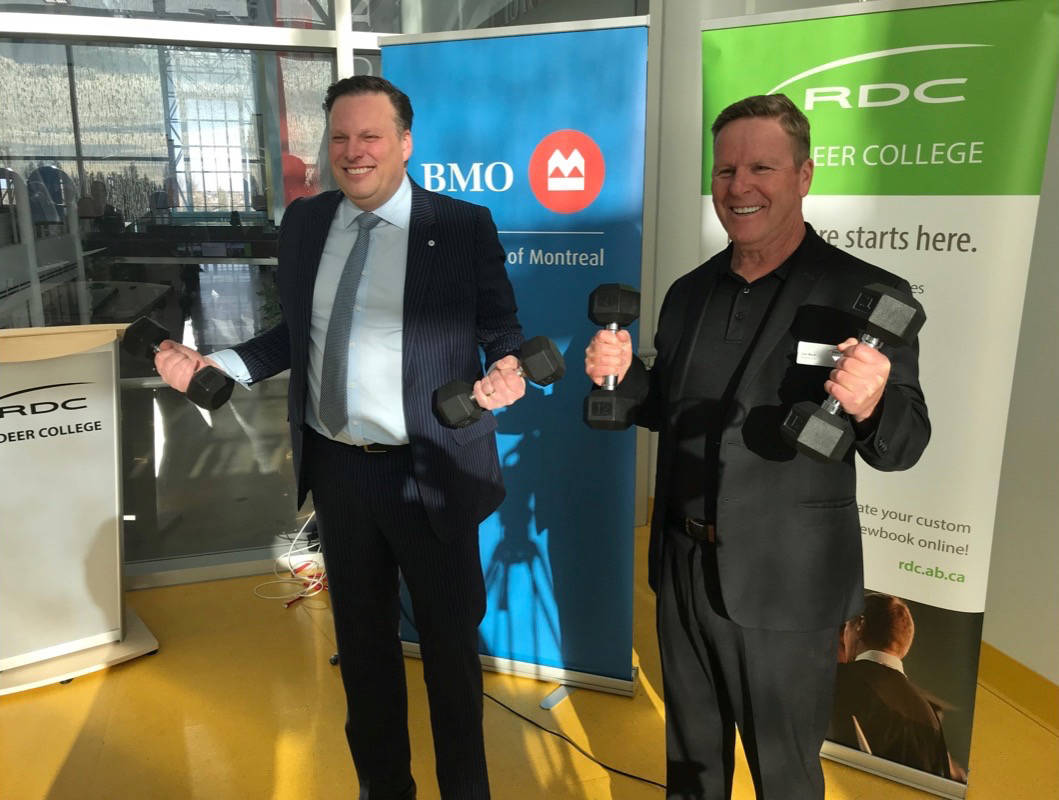 John MacAulay, BMO’s senior vice president division head - prairies NWT, and Joel Ward, president and CEO of Red Deer College, marked BMO’s $300,000 donation to the Shaping Our Future campaign on Monday at the Gary W. Harris Canada Games Centre.                                Mark Weber/Red Deer Express