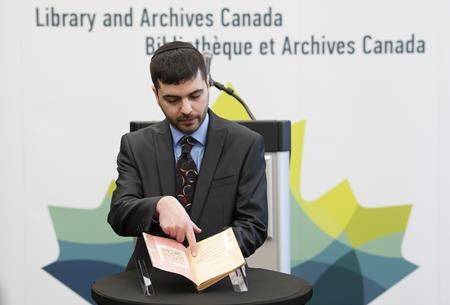 Michael Kent, curator of the Jacob M. Lowy collection, displays the German language book “Statistics, Media and Organizations of Jewry in the United States and Canada,” Wednesday January 23, 2019 in Ottawa. (THE CANADIAN PRESS/Adrian Wyld)