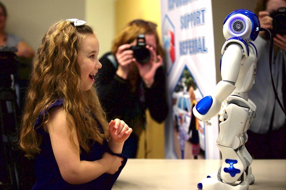 Laney Read, 6, interacts with the new RCMP robot she named Ard-E. The robot, which will help the Victim Services team support young victims, is the first robot used by a police force worldwide, according to the Red Deer RCMP. Robin Grant/Red Deer Express