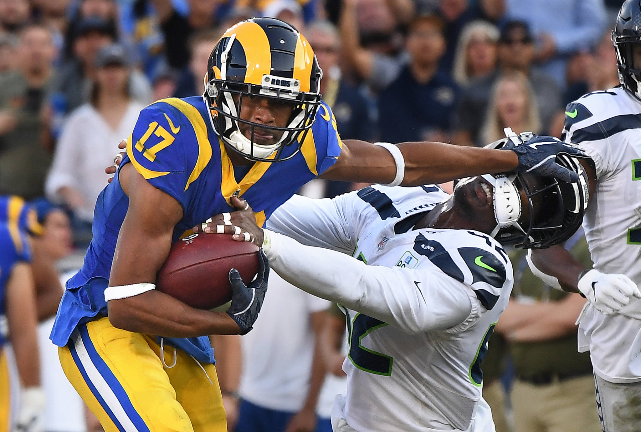 Los Angeles Rams receiver Robert Woods stiff-arms Seattle Seahawks safety Delano Hill to pick up yards in the third quarter on Sunday, Nov. 11, 2018 at the Coliseum in Los Angeles, Calif. (Wally Skalij/Los Angeles Times/TNS)