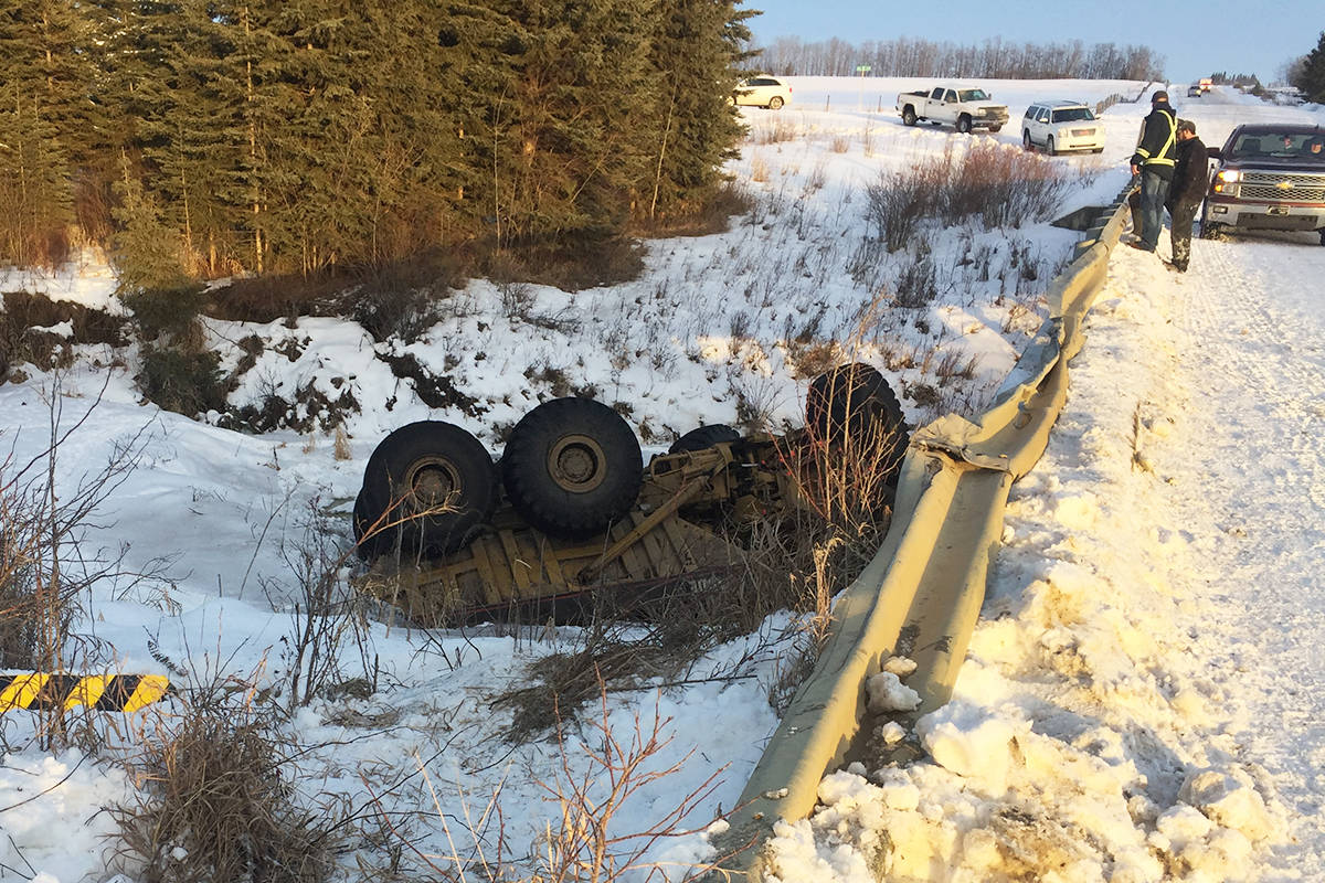 Emergency crews were called to the scene of a rock truck in a river Jan. 24. The incident occurred north of Crestomere. Police say wintry road conditions were the cause of the incident. Photo submitted