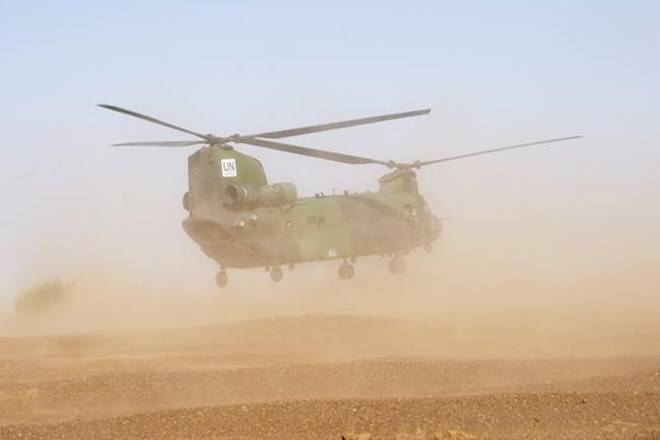 A Canadian Chinook helicopter takes off as it provides logistical support during a demonstration on the United Nations base in Gao, Mali, Saturday, December 22, 2018. Canadian peacekeepers in Mali have launched their second medical evacuation mission in less than a week after a UN armoured vehicle triggered an explosive device Friday, killing two and wounding six others. THE CANADIAN PRESS/Adrian Wyld