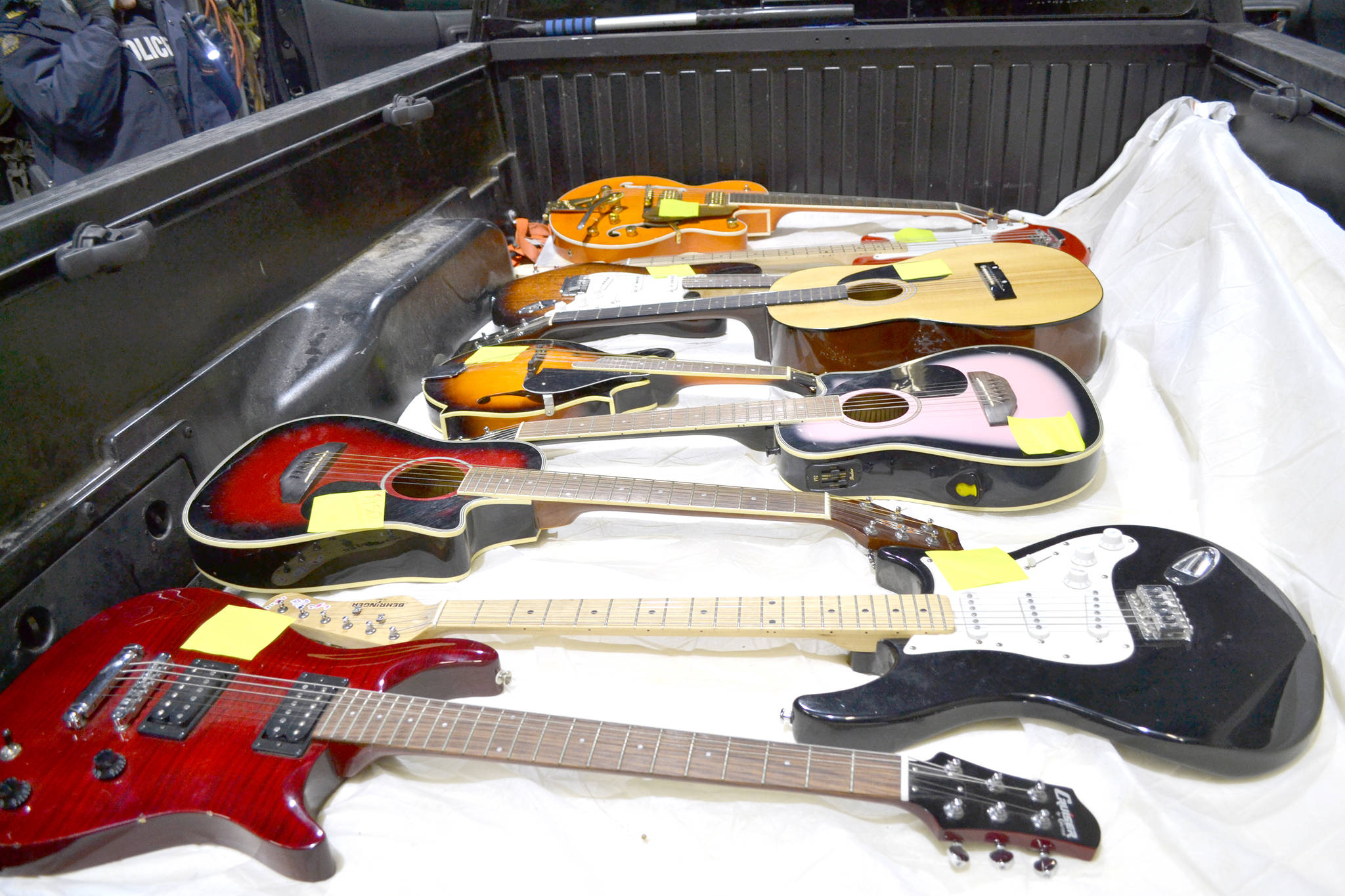 Undercover police officers and Innisfail RCMP recover $65,000 in musical instruments stolen from Red Deer County and charge two men. (RCMP photo)