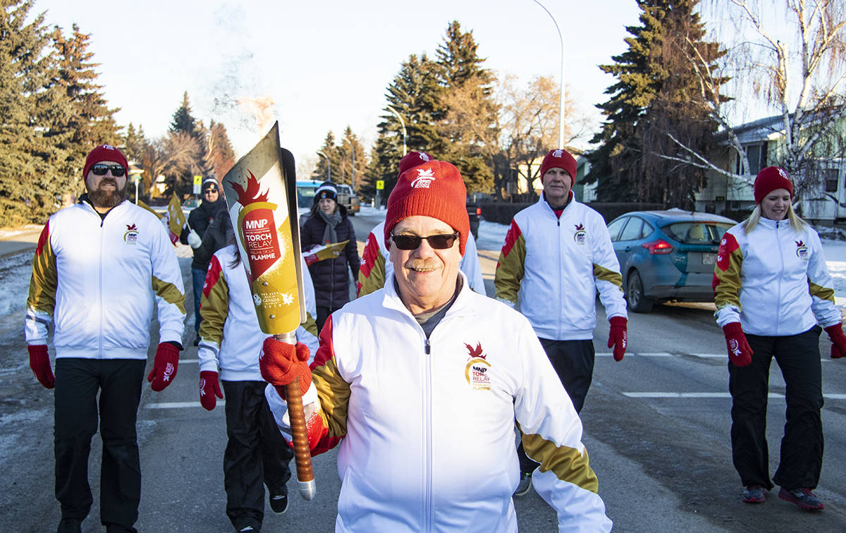 Blackfalds Mayor Richard Poole ran the final leg of the MNP Canada Games Torch Relay’s trek through the town. The 2019 Canada Games will be in Red Deer starting Feb. 15th. Todd Colin Vaughan/Lacombe Express