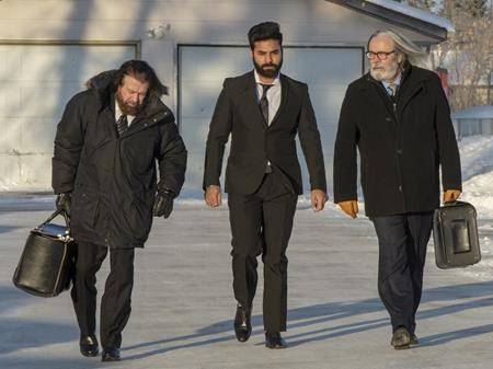 Jaskirat Singh Sidhu, centre, the driver of the truck that struck the bus carrying the Humboldt Broncos hockey team, arrives with his lawyers Mark Brayford, left, and Glen Luther, right, for the third day of his sentencing hearing, Wednesday, January 30, 2019 in Melfort, Sask. (THE CANADIAN PRESS/Ryan Remiorz)