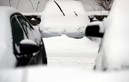 Cars are covered by snow, Monday, Jan. 28, 2019, in Wheeling, Ill. (AP Photo/Nam Y. Huh)